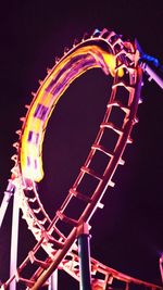 Low angle view of illuminated ferris wheel