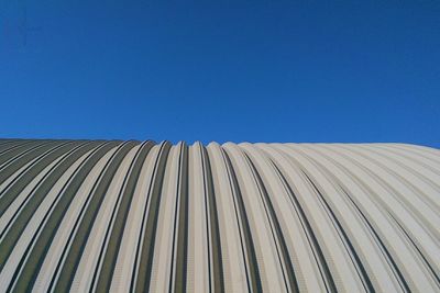 Low angle view of tree against clear blue sky