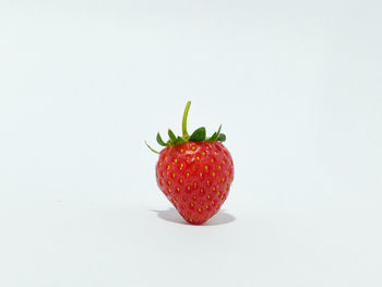 Close-up of strawberry against white background