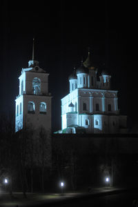 Low angle view of illuminated building against sky at night