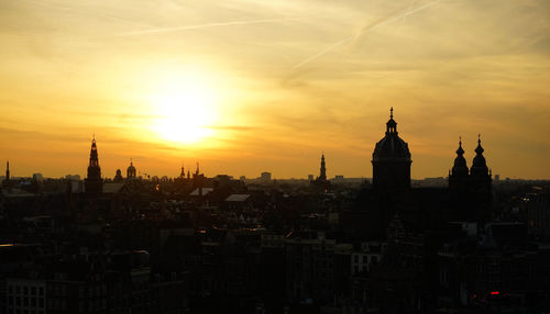 Cityscape against sky during sunset