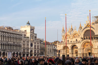 Group of people in front of historic building