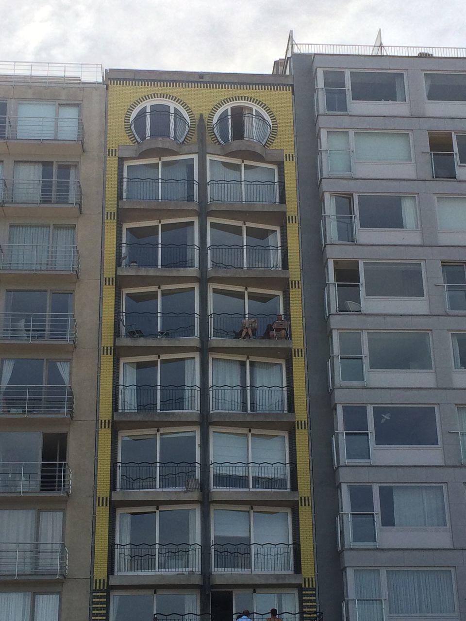 LOW ANGLE VIEW OF RESIDENTIAL BUILDING