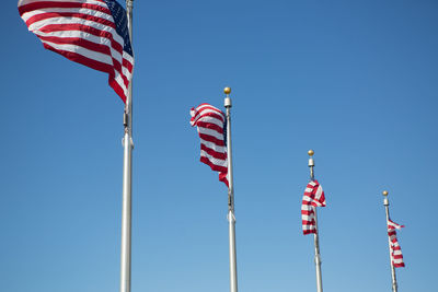 Low angle view of flags flag against clear sky