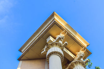 Low angle view of building against blue sky