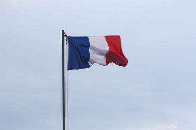 Low angle view of flag against sky