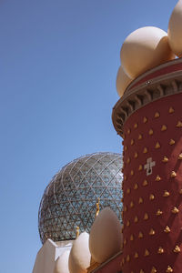 Low angle view of building against blue sky