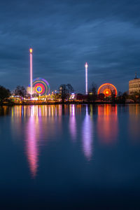 Illuminated ferris wheel at night