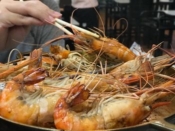 Close-up of hand holding meat