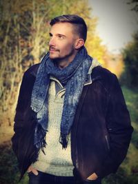 Young man in forest during autumn