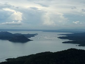 Scenic view of sea against cloudy sky