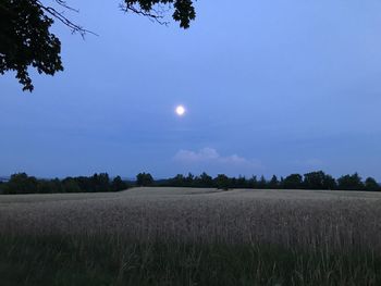 Scenic view of field against sky at night