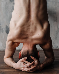 A man engaged in yoga and meditation, performing asanas