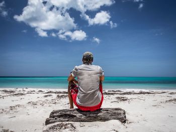 Rear view of man standing on beach