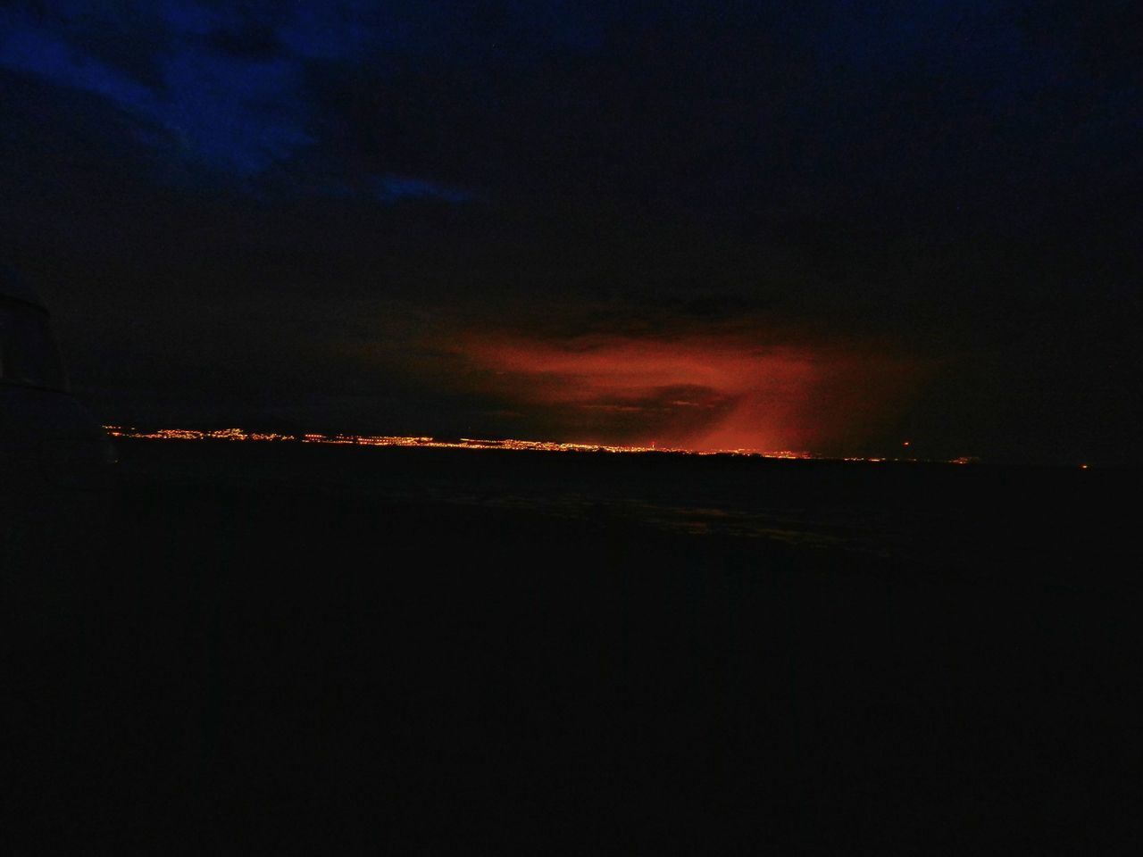 SILHOUETTE LANDSCAPE AGAINST DRAMATIC SKY AT NIGHT