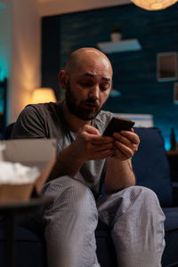 Young man using mobile phone