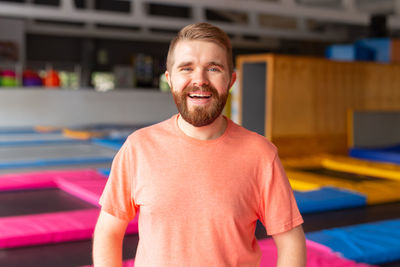 Portrait of smiling man standing at home