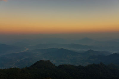 Scenic view of mountains at sunset