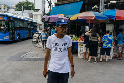 Men standing on street in city