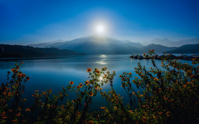 Scenic view of sea against blue sky