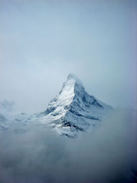 Scenic view of snowcapped mountain against sky