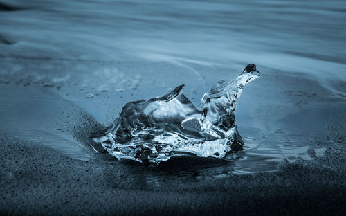 Close-up of ice on beach