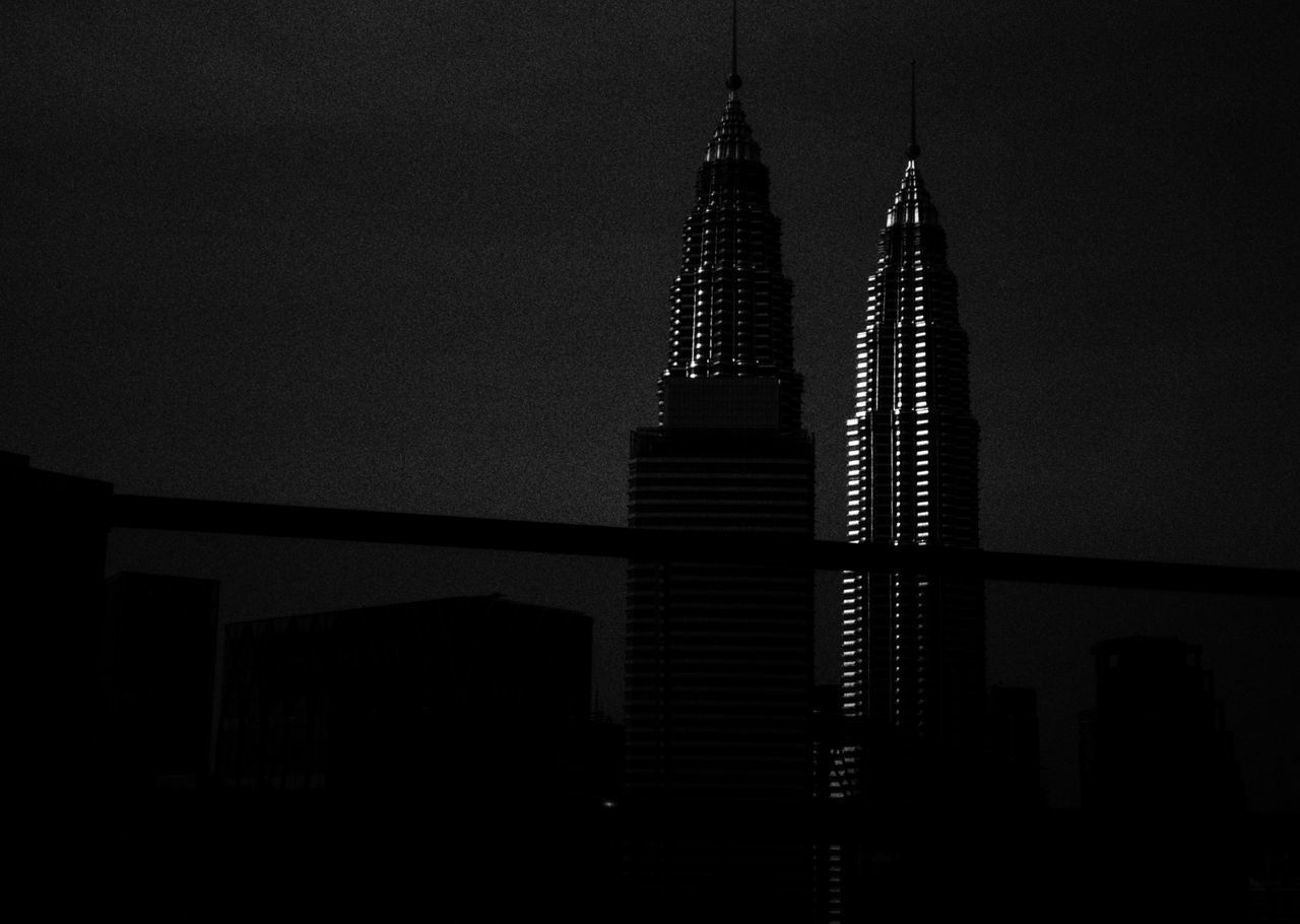 LOW ANGLE VIEW OF BUILDING AGAINST SKY AT NIGHT