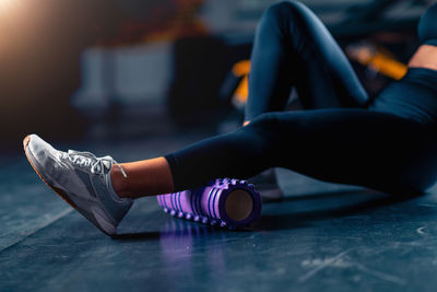 Low section of woman exercising in gym