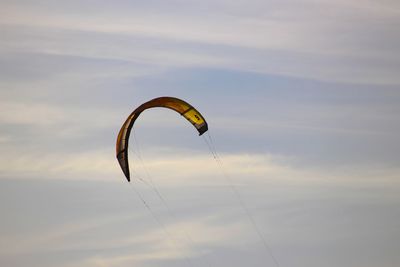 Low angle view of kite flying against sky