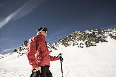 Man standing on snow covered mountain