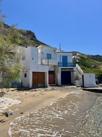 Built structures against clear blue sky