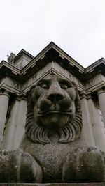 Low angle view of statue against building