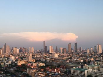 Cityscape against clear sky during sunset