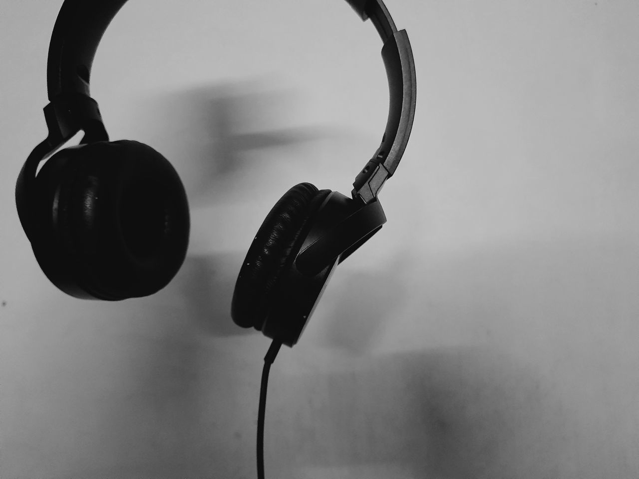 headphones, gadget, headset, electronic device, audio equipment, black and white, black, white, technology, music, indoors, arts culture and entertainment, monochrome photography, no people, monochrome, communication device, close-up, listening, communication