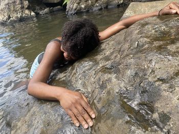 High angle view of woman on rock