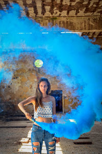 Woman holding smoke bomb