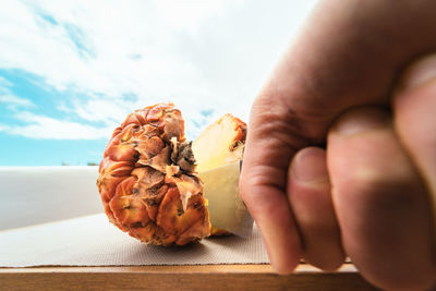 Close-up of hand holding ice cream