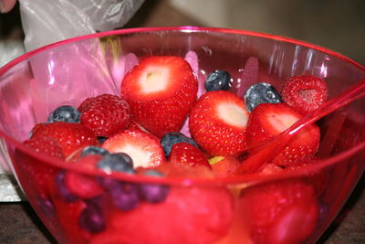 Close-up of berry fruits in bowl on table