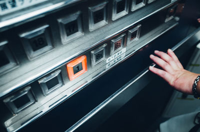 Cropped hand of baby touching machinery