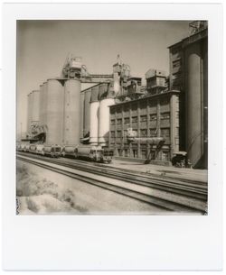 Railroad tracks amidst buildings against sky
