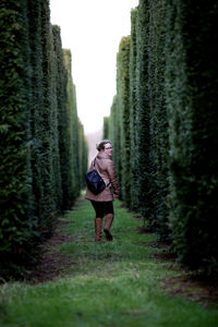 Rear view of woman walking in park