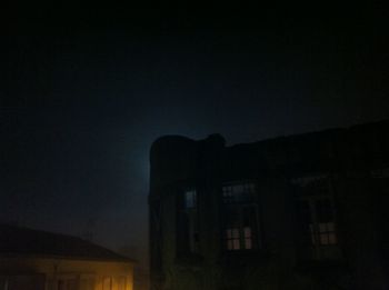 Low angle view of building against sky at night