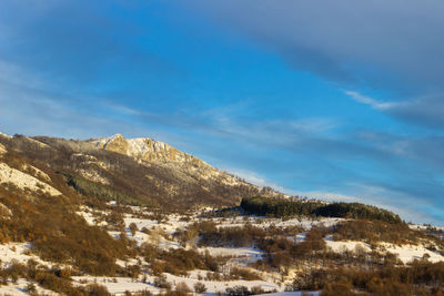 Scenic view of snowcapped mountain against sky