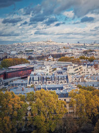 Aerial view over the paris city to the sacre coeur de montmartre basilica on the hill, france