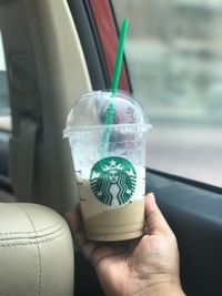 Close-up of hand holding drink