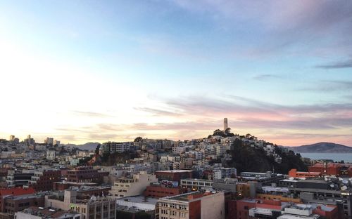 Cityscape against sky during sunset