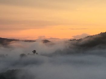 Scenic view of landscape against sky during sunset