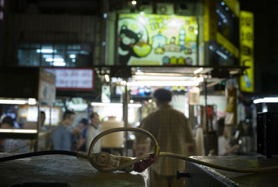 Electric cord connected at busy street market