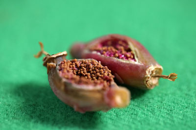 Close-up of strawberry on table against green background