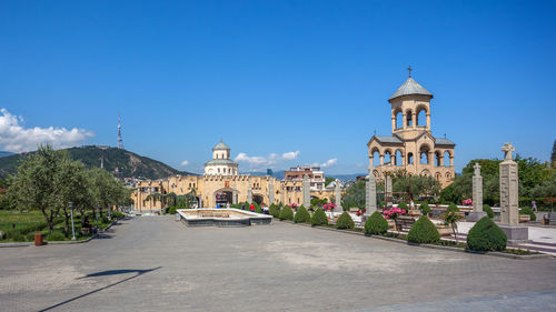 View of buildings against blue sky